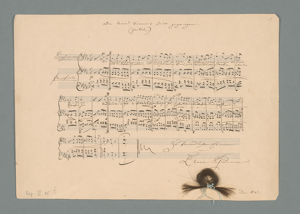 Reproduktion eines Autographen von Clara Schumann mit Haarlocke